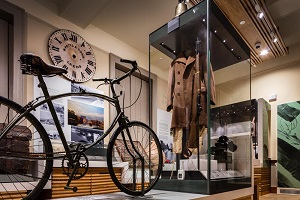 A look at the one of the two galleries of the Newark Museum with the parachute bike in the foreground and other cases behind.